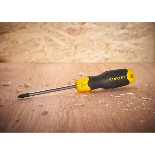 STANLEY 0-64-974 black and yellow Phillips screwdriver on wood, angled side view.