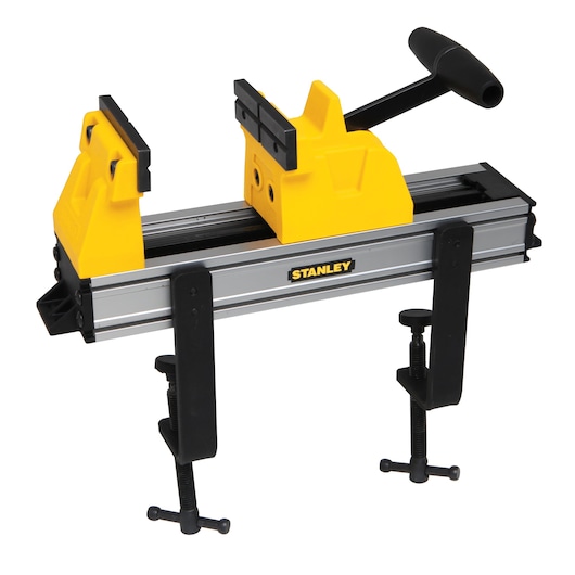 STANLEY portable vise with yellow jaws and clamps, designed for holding materials securely during work.