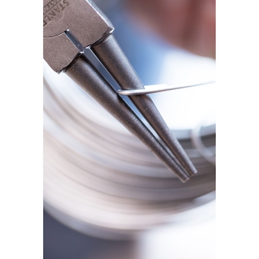 STANLEY 0-84-496 round nose pliers bending wire, close-up photography.