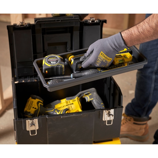 STANLEY 1-70-326 toolbox with hand lifting tray containing tape measure and tools, construction setting.
