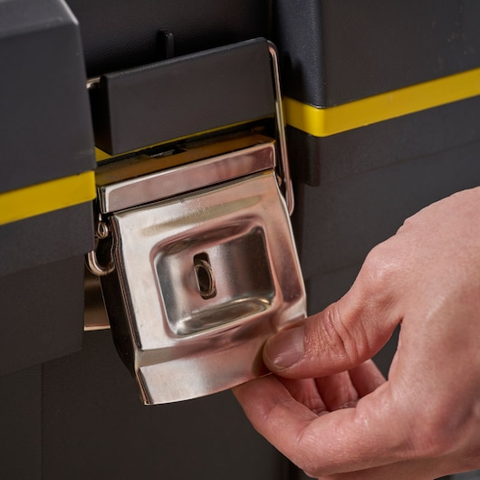 Photo of STANLEY 1-92-904 toolbox steel latch close-up with hand opening the latch.