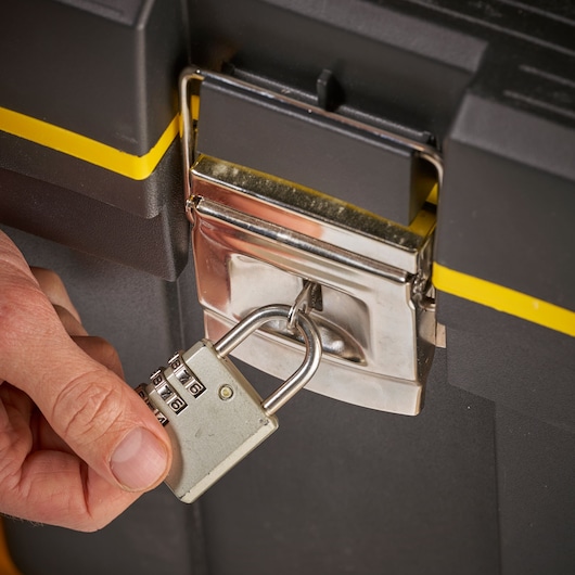 STANLEY 1-92-904 toolbox close-up with yellow stripe and padlock on latch.