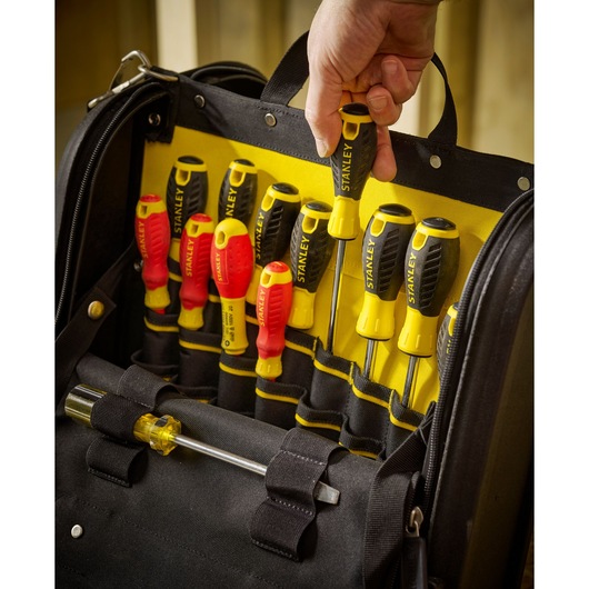 STANLEY 1-94-231 screwdriver set in black and yellow tool bag, hand removing screwdriver, front angle.