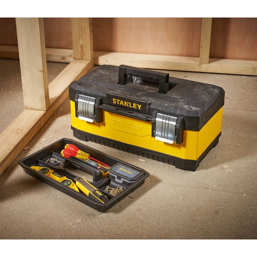 STANLEY 1-95-612 toolbox with yellow body, black lid, metal latches, tray and hand tools, angled view