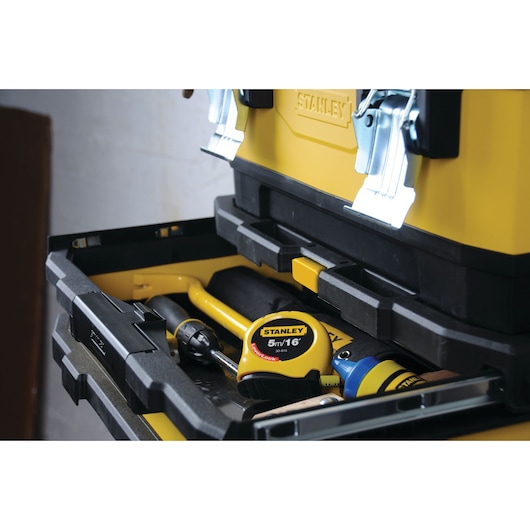STANLEY 1-95-621 toolbox with open drawer showing tape measure and various tools inside, angled view.