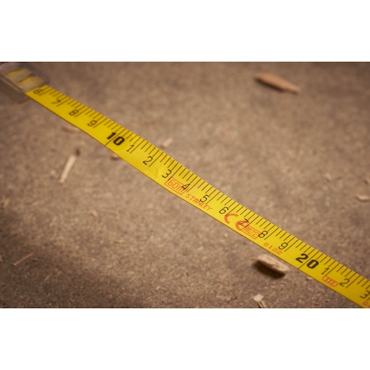 STANLEY 2-34-775 yellow tape measure photography, close-up showing measurement markings.