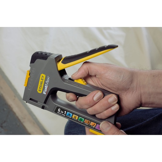 Stanley FMHT0-70868 FatMax 6-in-1 stapler, grey and yellow, handheld side view.