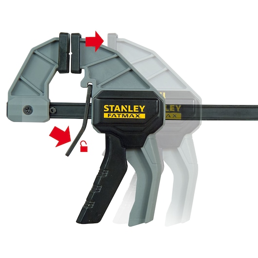 STANLEY FMHT0-83232 quick-change bar clamp with black and gray body, red arrows indicating release mechanism, side angle.
