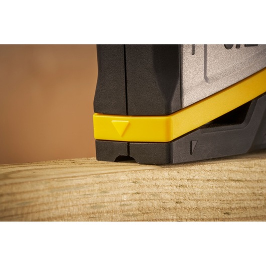 STANLEY FMHT70401-0 photography of black and yellow tool detail, close-up angle on wood surface.