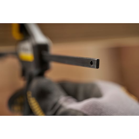STANLEY FMHT83270-0 clamp bar close-up held by gloved hand, photography product.