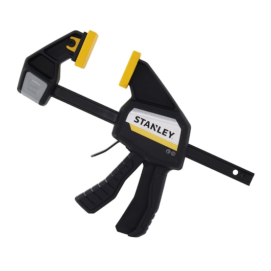 STANLEY FMHT83273-0 photography of black and yellow quick-adjust bar clamp, side angle on white background.