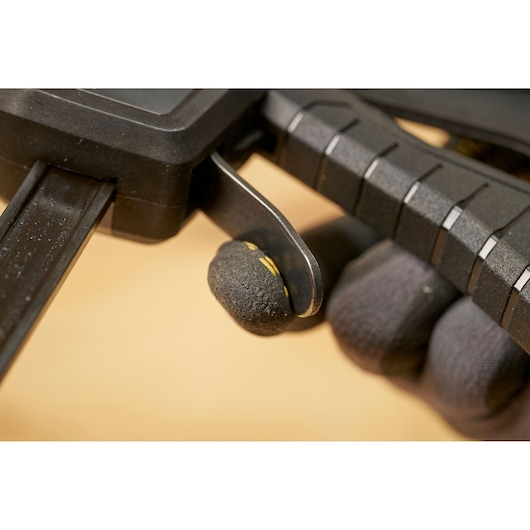 STANLEY FMHT83276-0 clamp trigger close-up, black handle with textured grip, photography