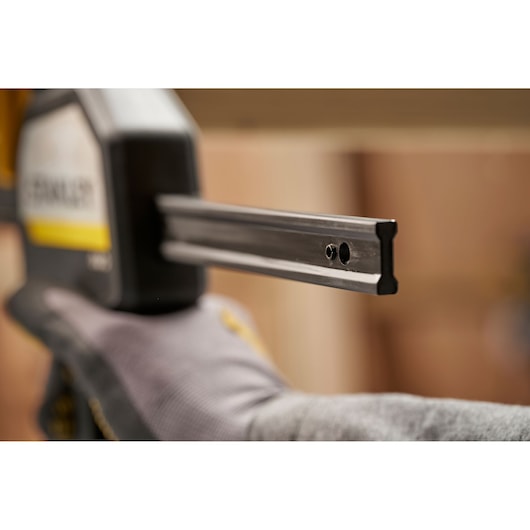 STANLEY FMHT83278-0 photography of clamp bar end in close-up, with gloved hand holding tool.