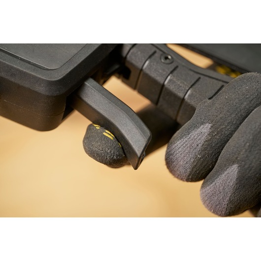 STANLEY FMHT83279-0 photography of black clamp handle held by gloved hand, close-up, side angle.