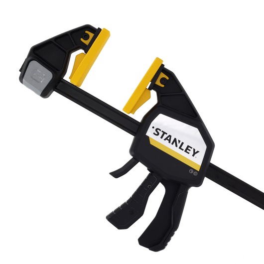STANLEY FMHT83280-0 photography of black and yellow trigger clamp, side angle on white background.