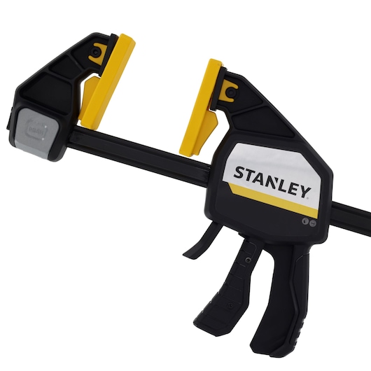 Stanley FMHT83282-0 photography of black and yellow trigger clamp, front angle on white background.