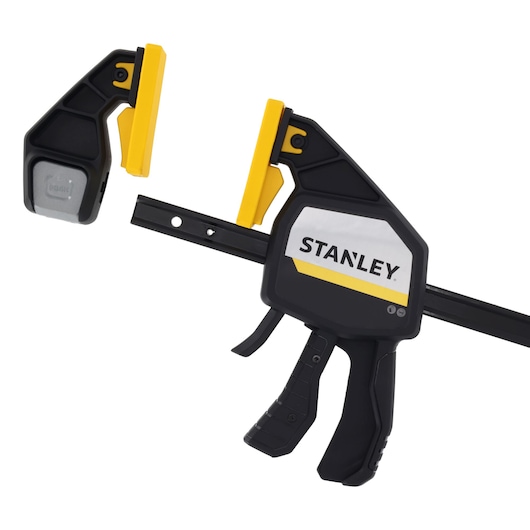 STANLEY FMHT83282-0 photography of black and yellow trigger clamp, side angle on white background.