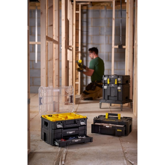 STANLEY FMST1-71968 stackable toolboxes and organizers in a construction site, open and closed views.