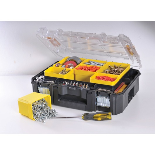 STANLEY FMST1-71970 organizer box with transparent lid, yellow compartments filled with screws, nails, and hardware on white background.