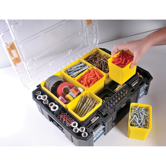 STANLEY FMST1-71970 black tool organizer with open lid, yellow compartments holding hardware and tapes, top view.