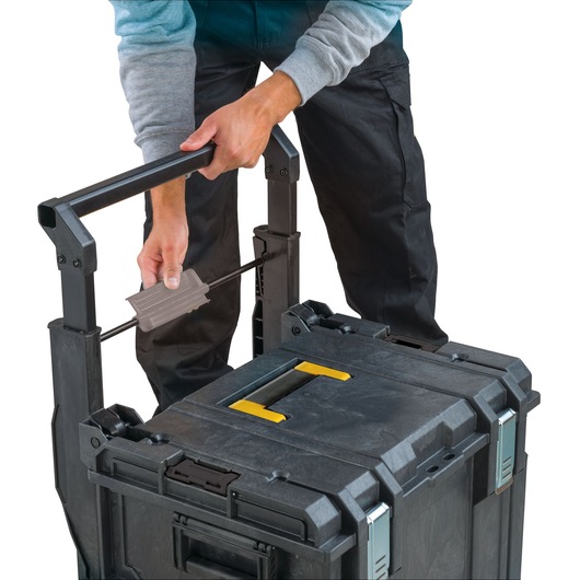 STANLEY FMST1-75798 rolling toolbox with adjustable handle, close-up photo of handle being extended.
