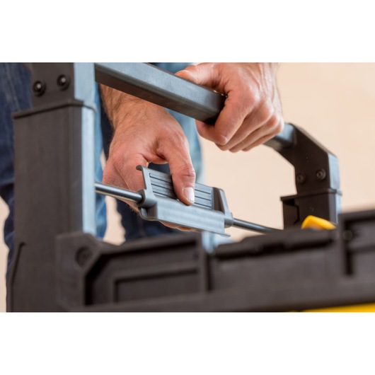 Photo of STANLEY FMST1-75798 handle adjustment on storage box, close-up angle.
