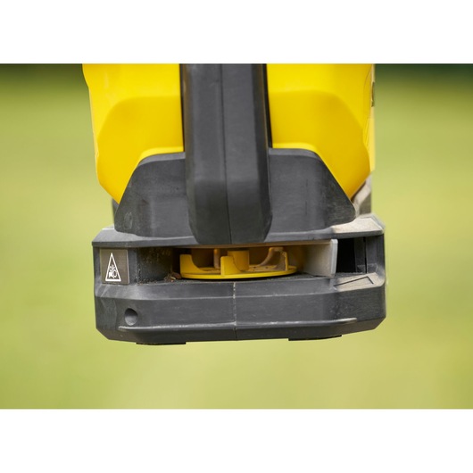 STANLEY STCOE300D1 power tool base close-up, yellow and black plastic exterior, outdoor background