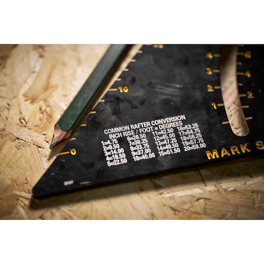 STANLEY STHT46055-0 black rafter square with conversion chart, close-up angle, photography product.