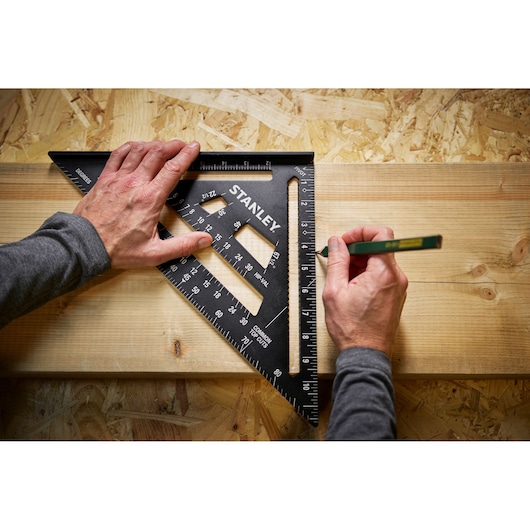 Photo of STANLEY STHT46105-0 black speed square ruler used to mark wood during woodworking.