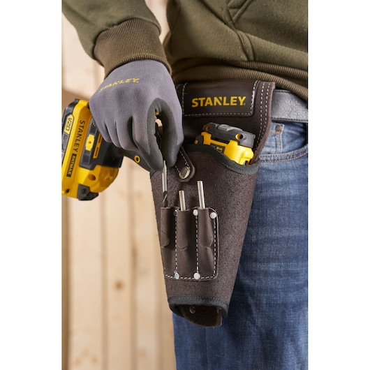 Photo of STANLEY STST1-80118 leather tool holster with tools, attached to a belt at the waist.